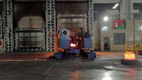 The material remover picks up the forging from the natural gas furnace