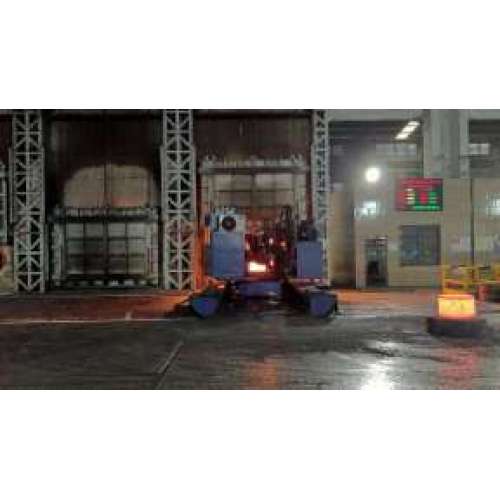 The material remover picks up the forging from the natural gas furnace