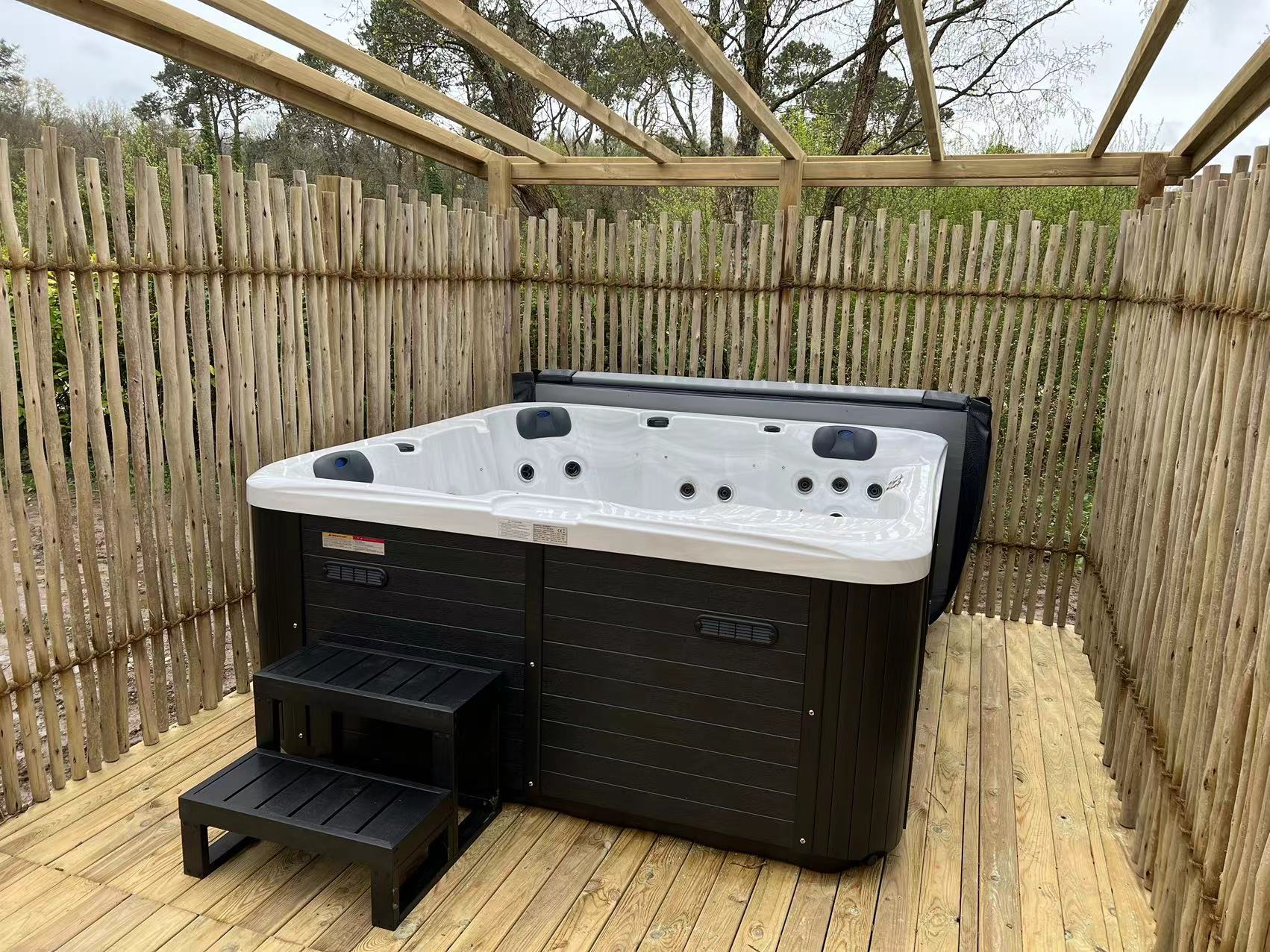Modern hot tub installed in luxury resort setting