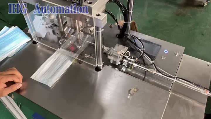 photoelectric sensor 2 spot ear loop ultrasonic welding machine.mp4