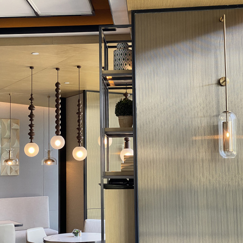 Modern decorative glass chandeliers and wall lamps in the hotel restaurant