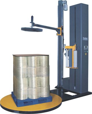 Top sheet pallet stretch wrapping machine