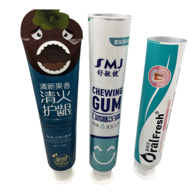 white and green toothpaste tube