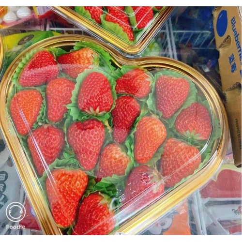 ** Caixa de embalagem sempre em forma de coração verde - onde comida encontra romance **