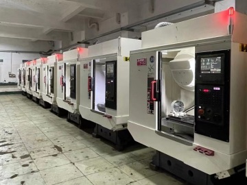 What is a CNC machining center and its functions