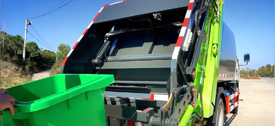 Video of rear mounted garbage compactor