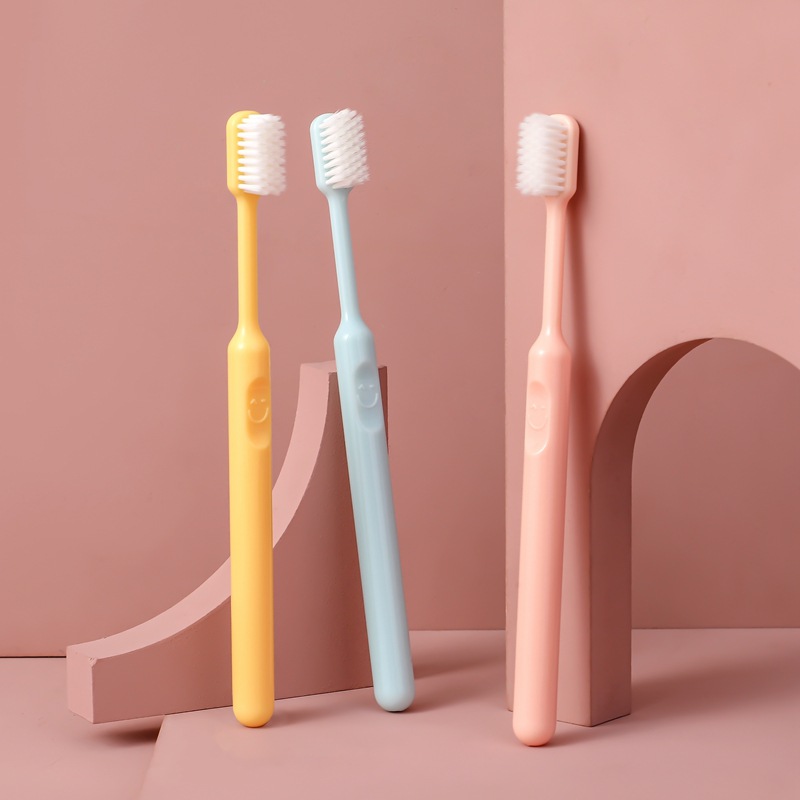 Candy colored smiley face toothbrush