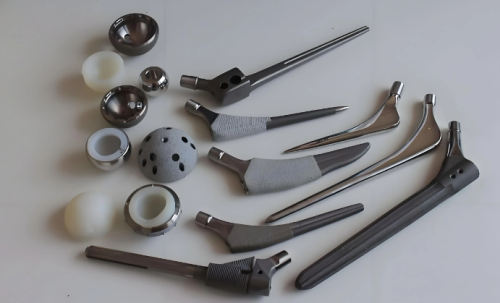 Why doesn’t the human body reject titanium alloys? Why does it repel other metals?