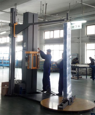 Door stretch wrapping machine