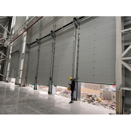 Automatic thermal insulated overhead sectional doors finished for Telsla car parts factory