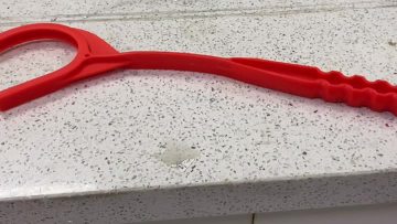 Handheld target throwing machine