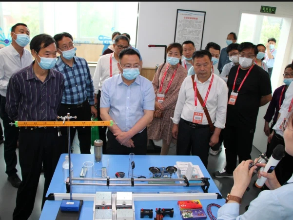 Visitors Observing Scientific Equipment Demonstration