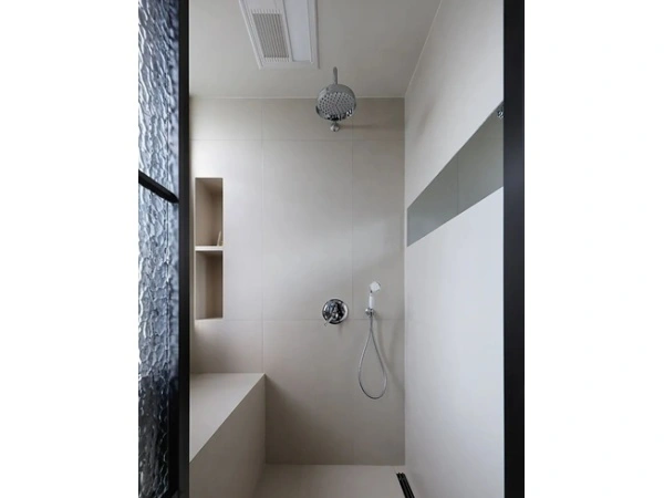 Contemporary residential bathroom design with wall mounted faucet