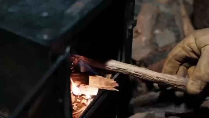 Titanium tent stove