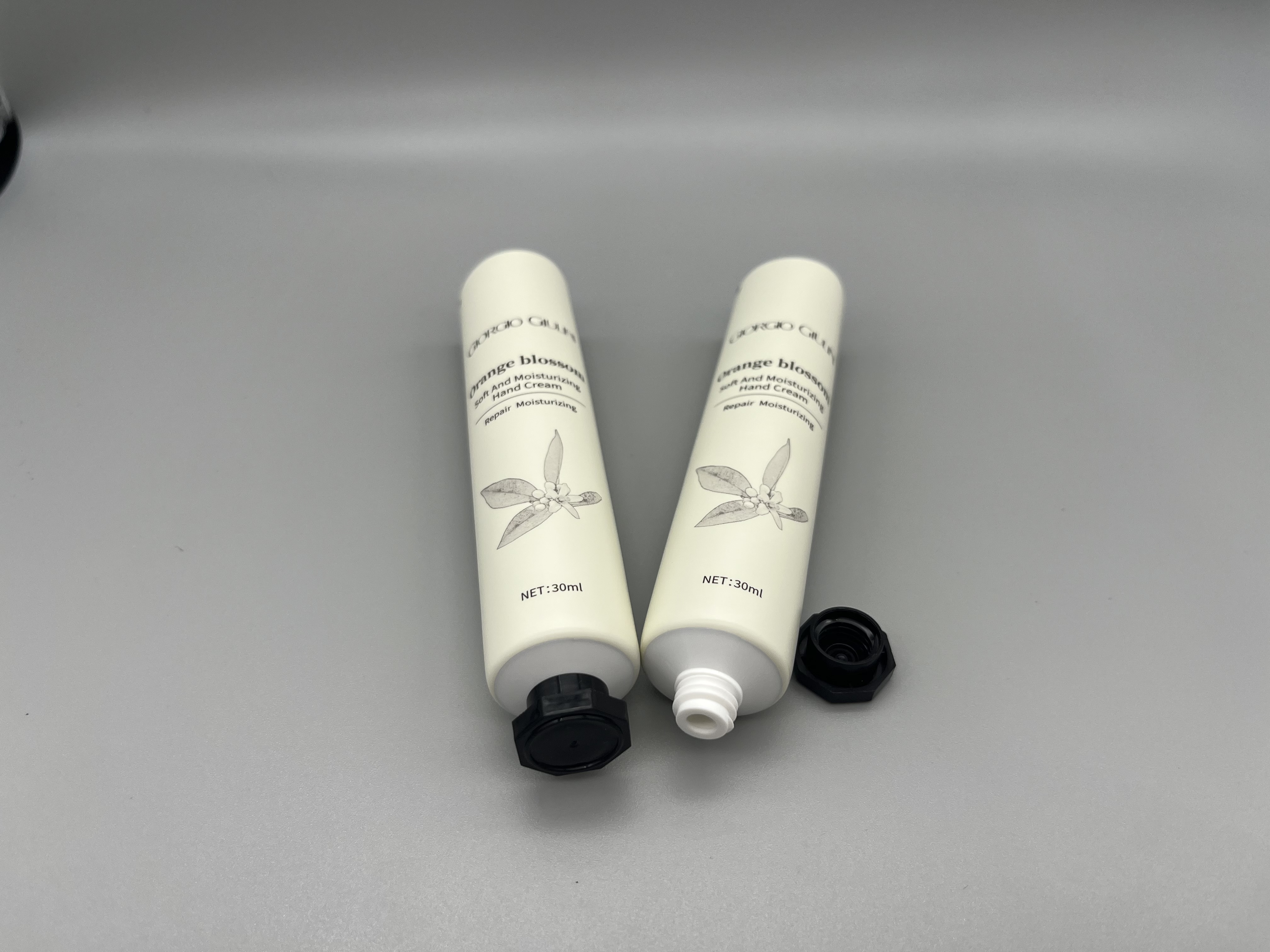 white matte hand cream tube with octagonal cap 