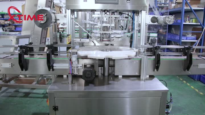 Rotary plate type film covering machine