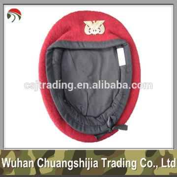 red wool military beret with insignia
