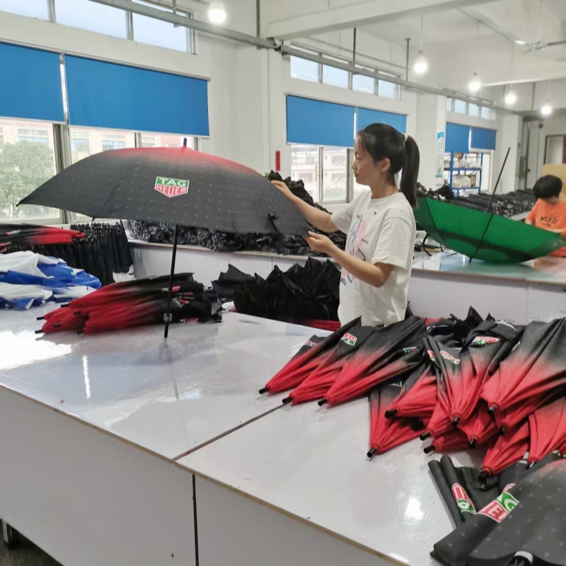 Quality-inspector-checking-umbrella