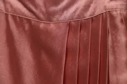 long pink pleated skirt