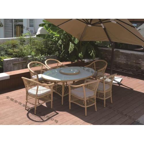 Outdoor Table with Rattan Chairs and Umbrella