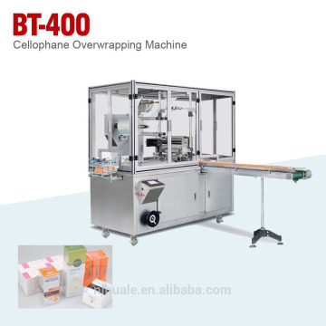 CELLOPHANE OVERWRAPPING MACHINE