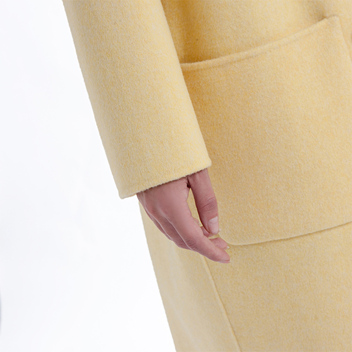 The sleeves of the new yellow cashmere winter coat