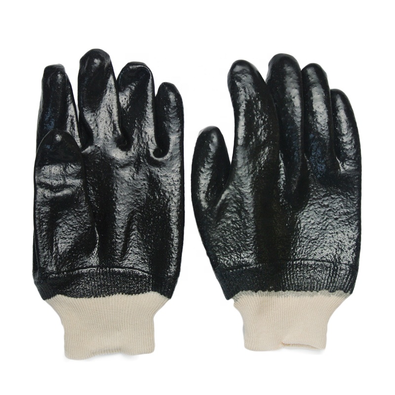 Guantes de PVC negros. acabado rugoso .Tejido de muñeca