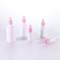 Opal white essential oil bottle with pink dropper