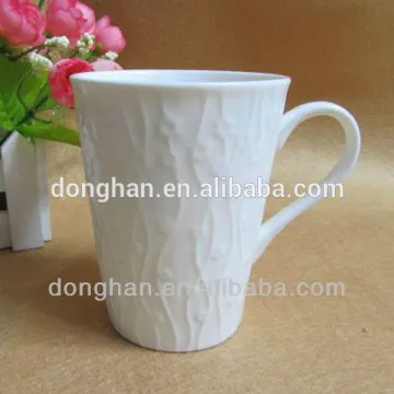 white embossed ceramic mug