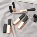 Square black and golden lipstick tube