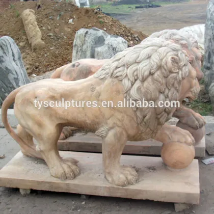 The lion statues standing on the ball
