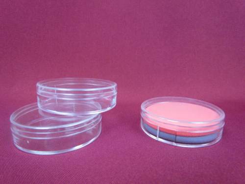 Cosmetic facial puff in hard plastic round clear case