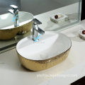 High-End Luxury: Golden-Rounded Plated White Cover One-Piece Wall-Mounted Toilet Bowl with Printed Design and Solid Ceramic Hand