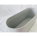 Oval vertical rippled metal pot