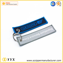 Embroided remove before flight LOGO key ring
