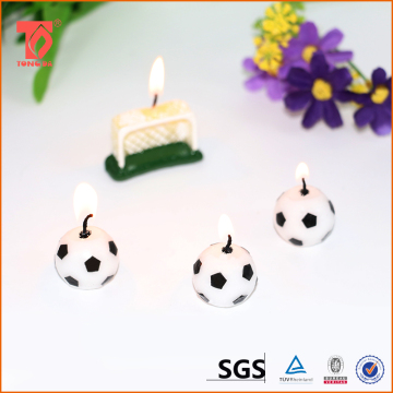 Decorative football shaped birthday candles for party