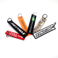 Wéckelt Stoff ëmgedréinte Numm Keychain personaliséiert Designen