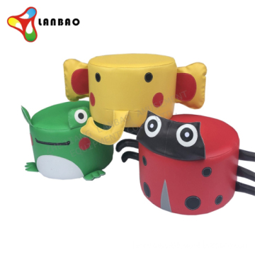 Cartoon-Themed Children's Indoor Play Area with Circular Stools and Soft Equipment