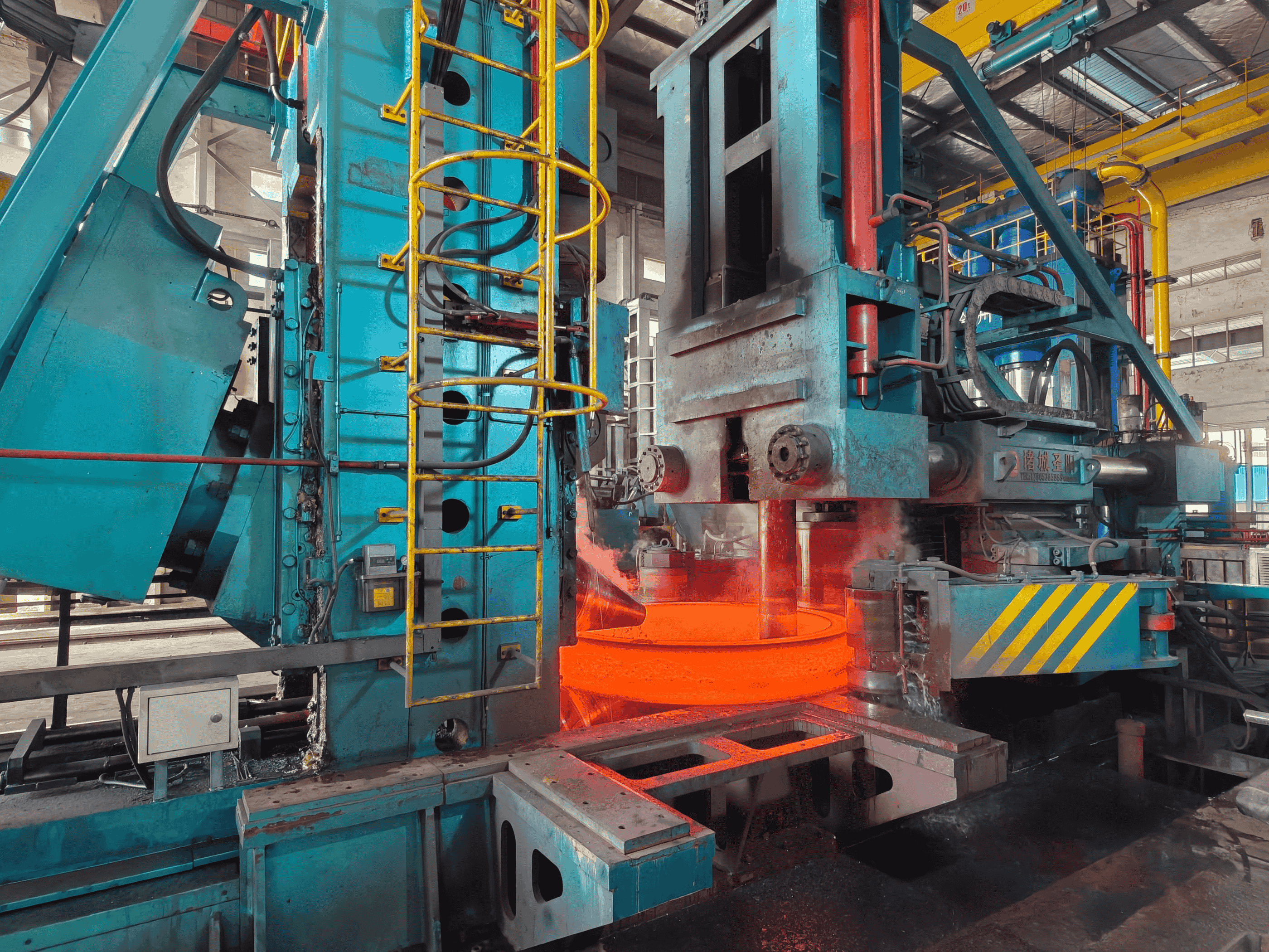 Forged ring being shaped on the ring rolling machine