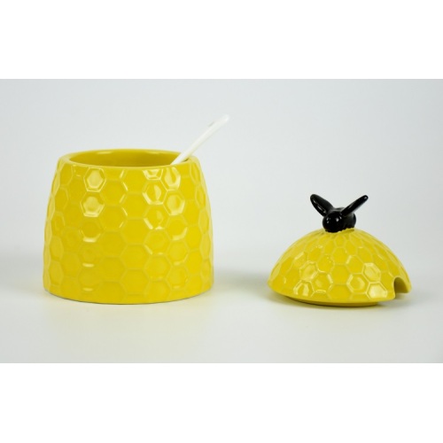 Vasilha de cerâmica amarela em forma de abelha com tampa