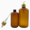 Amber frosted plastic lotion bottle with bamboo lid