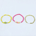 Yellow smiley face glass bead elastic bracelet