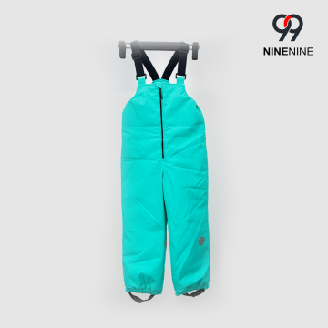 Pantalones con peto de esquí color turquesa liso para niños con estilo
