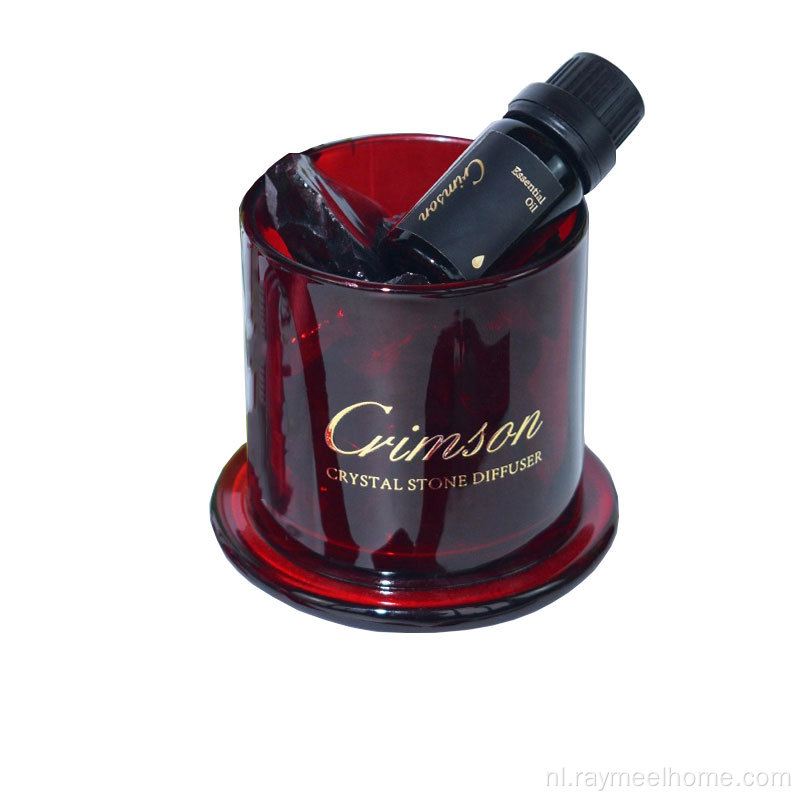 kristalsteen diffuser in rode glazen pot