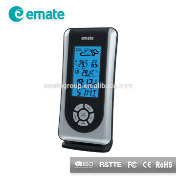 household using weather station with clock