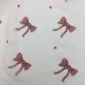 Maglia in tulle di poliestere glitterato con punti di fiocco