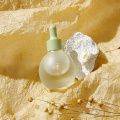Embalaje de botella de aceite de cabello helado vacío