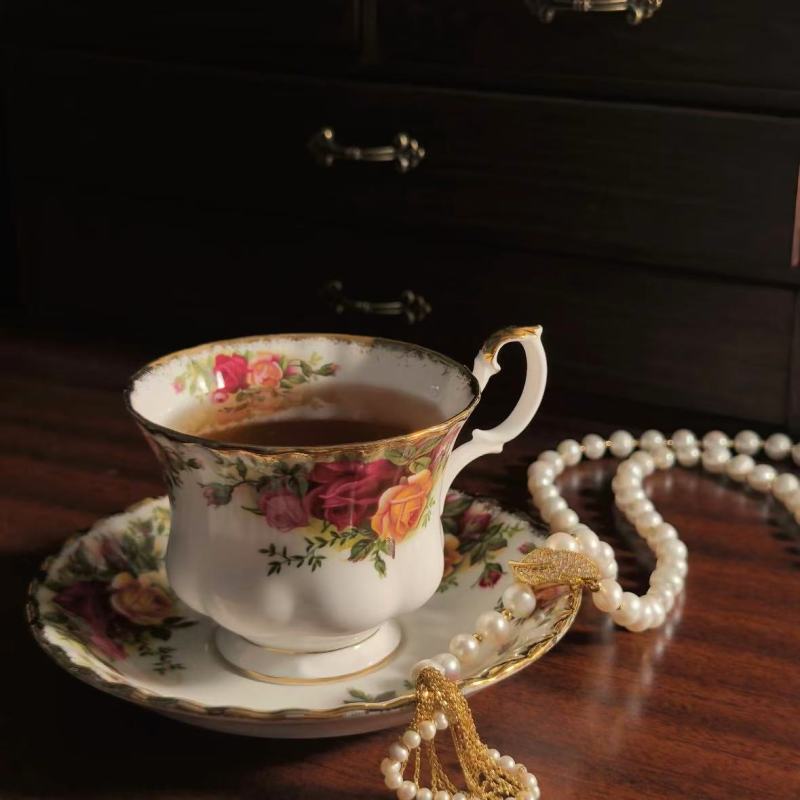 Elegant Porcelain Tea Set with Floral Design and Gold Trim