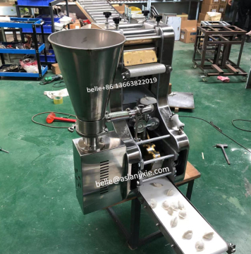 Cheese Stuffed Empanada and Gyoza Maker Machine" 

However, considering the variety of items mentioned, a more inclusive title might be:

"Multi-Purpose Dumpling and Samosa Making Machine - Beef, Cheese Stuffed, and Gyoza" 

But if you need just one that 