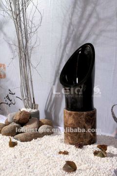 Black floor standing urinal